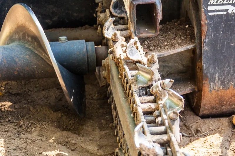 Trencher and auger attachments used for irrigation and planting